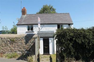 Almost a tiny house project: it's compact, only 1 bed, and doesn't have a lot of garden space, but it's detached. With fireplace and chimney. Near Coleford in the Forest of Dean. £115k. http://www.stevegooch.co.uk/propertyDetails.php?pid=497701